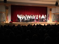 wide shot of sixth grade chorus members singing