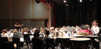 wide shot of seventh and eighth grade band members performing