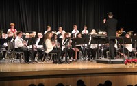 medium shot of seventh and eight grade band performing