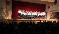 wide shot of seventh and eighth grade chorus members singing