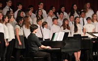another medium shot of seventh and eighth grade chorus members singing