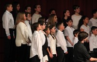 seventh and eighth grade chorus members singing