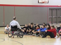 adaptive sports instructor speaking with students