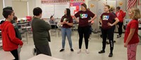 high school yes leads presenters working with middle school students
