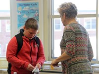 student and instructor talking