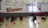 students taking part in adaptive sports in gymnasium