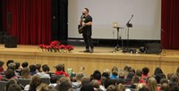 medium shot of jared campbell speaking to students