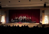 wide shot of students singing