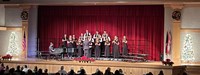wide shot of students singing in winter concert