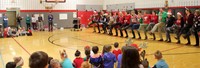 teachers doing a dance performance for students