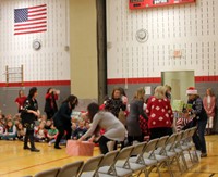 wide shot of teachers stacking presents for activity