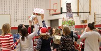 medium shot of teachers stacking presents for activity