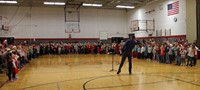 wide shot of students singing at holiday sing along 