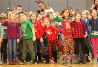 students dancing at holiday sing along