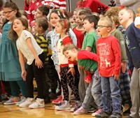 students singing and dancing