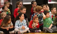 wide shot of students singing and dancing