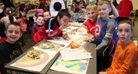 students at table during friendship feast