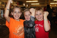 four students smiling at friendship feast