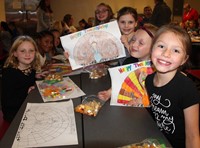 two students smiling at friendship feast