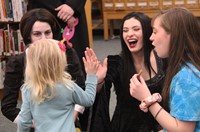 child giving student high five