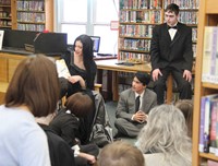 medium shot of theatre guild member reading book