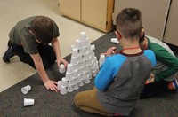 students working on 100 days of school activity in classroom