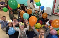 students celebrating 100 days of school with balloons