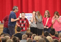 students laughing at presenter's joke