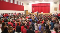 wide shot of presenter speaking with students