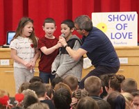 students singing at assembly