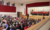 wide shot of mister vanderslice speaking with chenango bridge elementary students