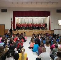 wide shot of theatre guild members performing at chenango bridge elementary