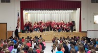 wide shot of high school students performing for chenango bridge elementary