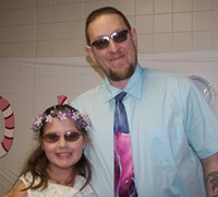 two people wearing sunglasses at winter dance