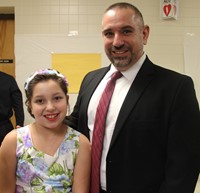 two people smiling at p t a dance