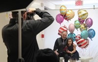 photographer taking a picture of two people