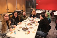 students and teacher working on glass projects