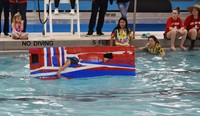 students competing in cardboard boat races