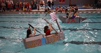 students competing in cardboard boat races