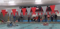 wide shot of students competing in boat races