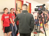 students being interviewed by reporter