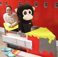 two students with cardboard boat