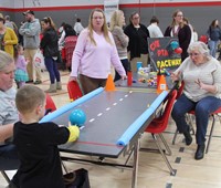 student taking part in p t a raceway activity