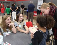 student taking part in girl scouts activity