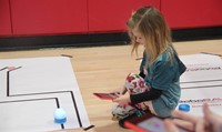 student taking part in steam night activity