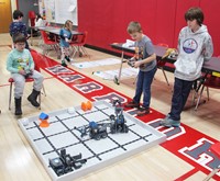 students playing with robots