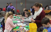 students playing with legos for activity