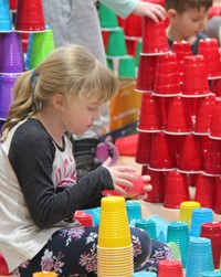 student stacking cups