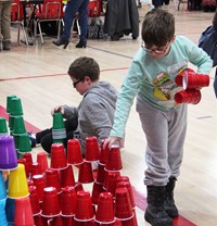 student stacking cups