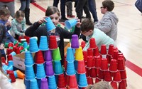 student stacking cup tower